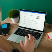 rear-view-adult-man-searching-new-job-working-writing-his-resume-laptop_662251-2153